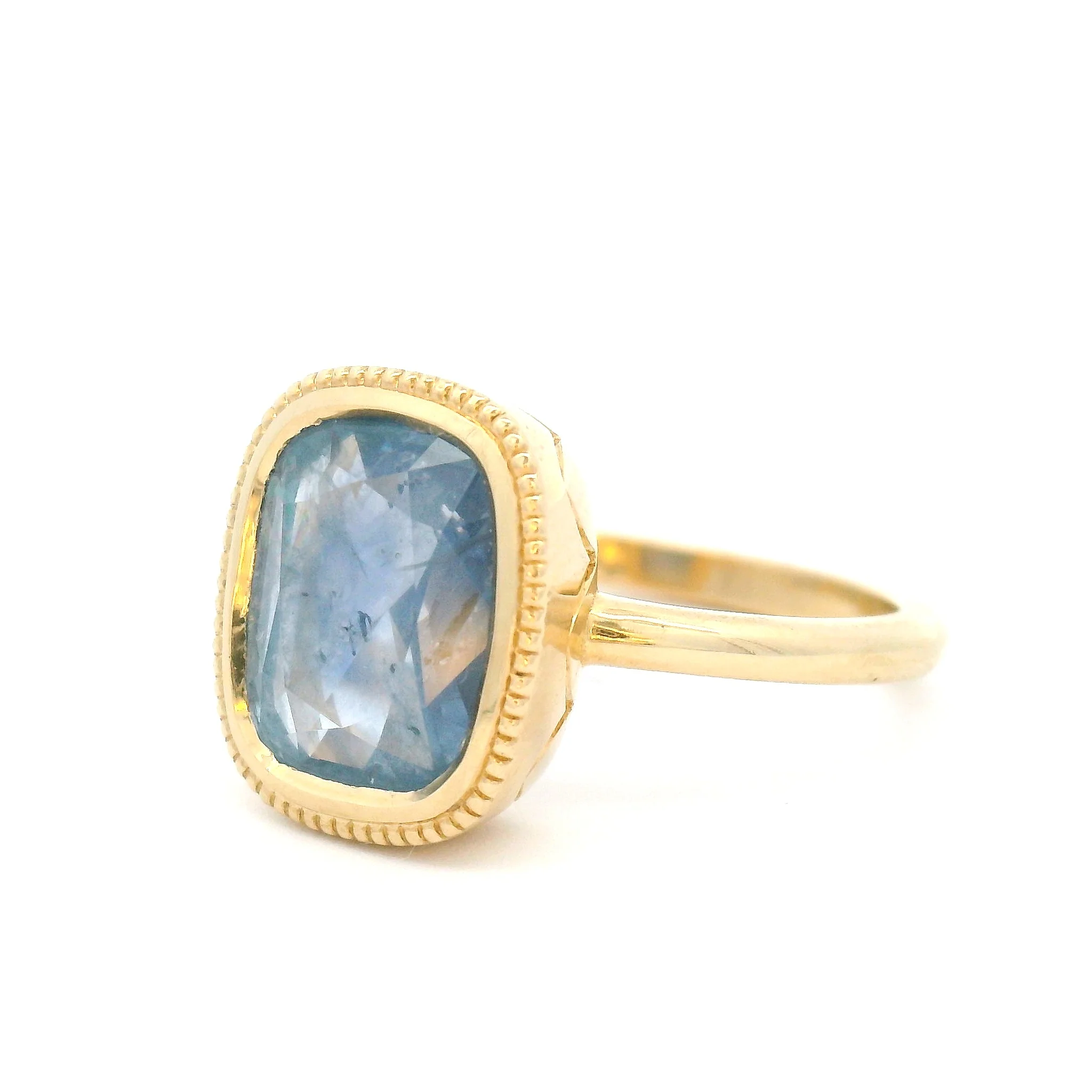 10k Yellow Bezel-Set Solitaire with 3.75ct Cushion-Cut Light Blue Sapphire Accented with Hand-Engraving - Image 2