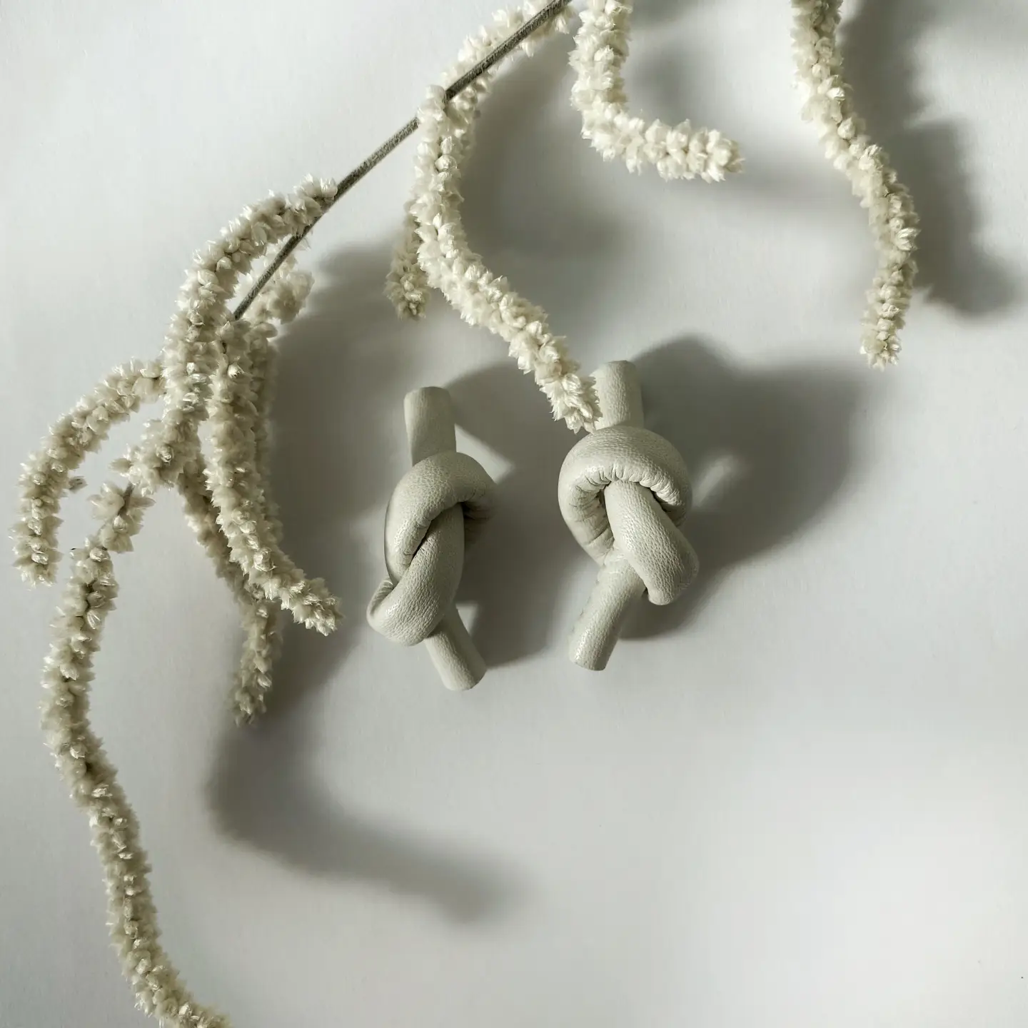 White Leather Knot Earrings - Image 2